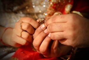 A couple showing rings during Ring Ceremony Photography