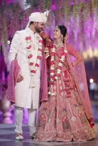 a full portrait shot of bride and groom cherish together